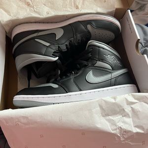 Gray and black nike jordan’s